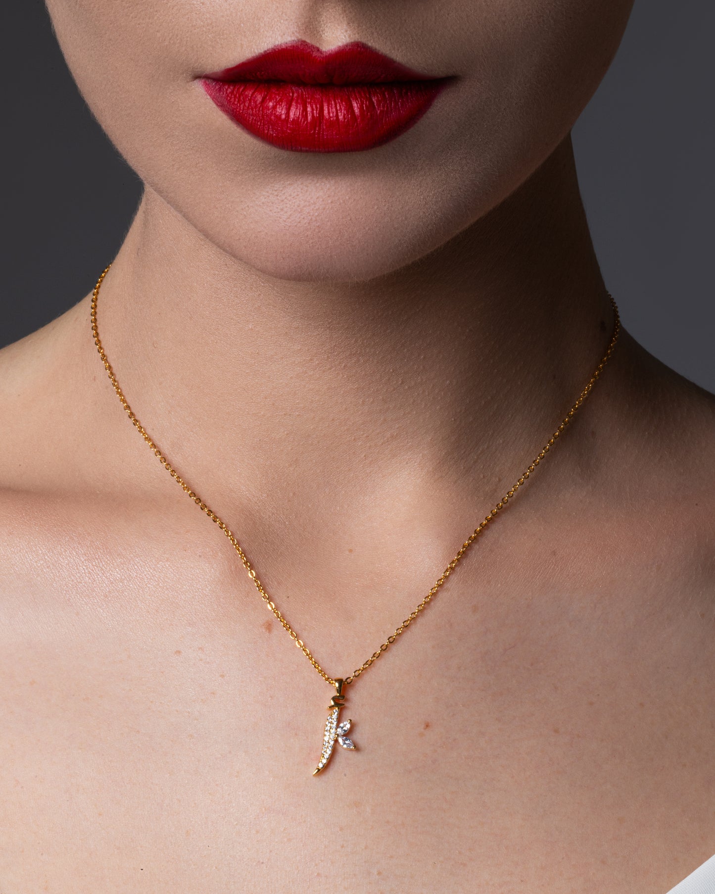 Arabic script necklace with the letter 'Alif' encrusted with diamonds